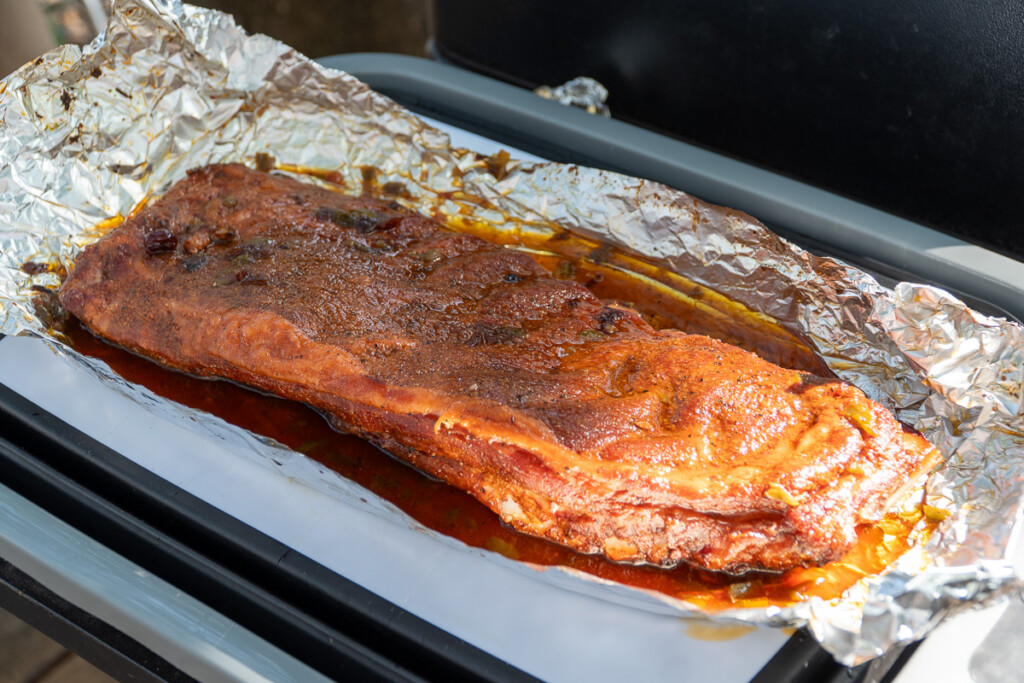 cooked ribs in aluminum foil