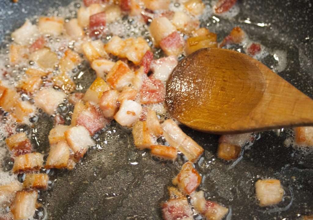 chopped bacon in pot