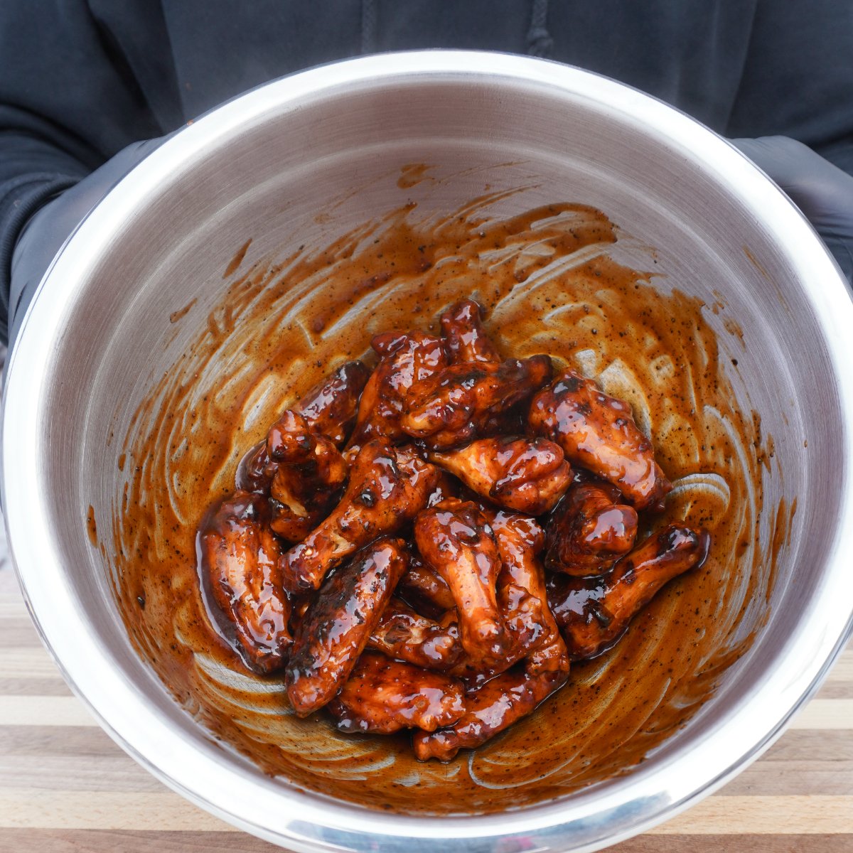 Sauced up wings in a bowl.