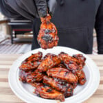 Perfectly grilled chicken wings in a BBQ sauce.