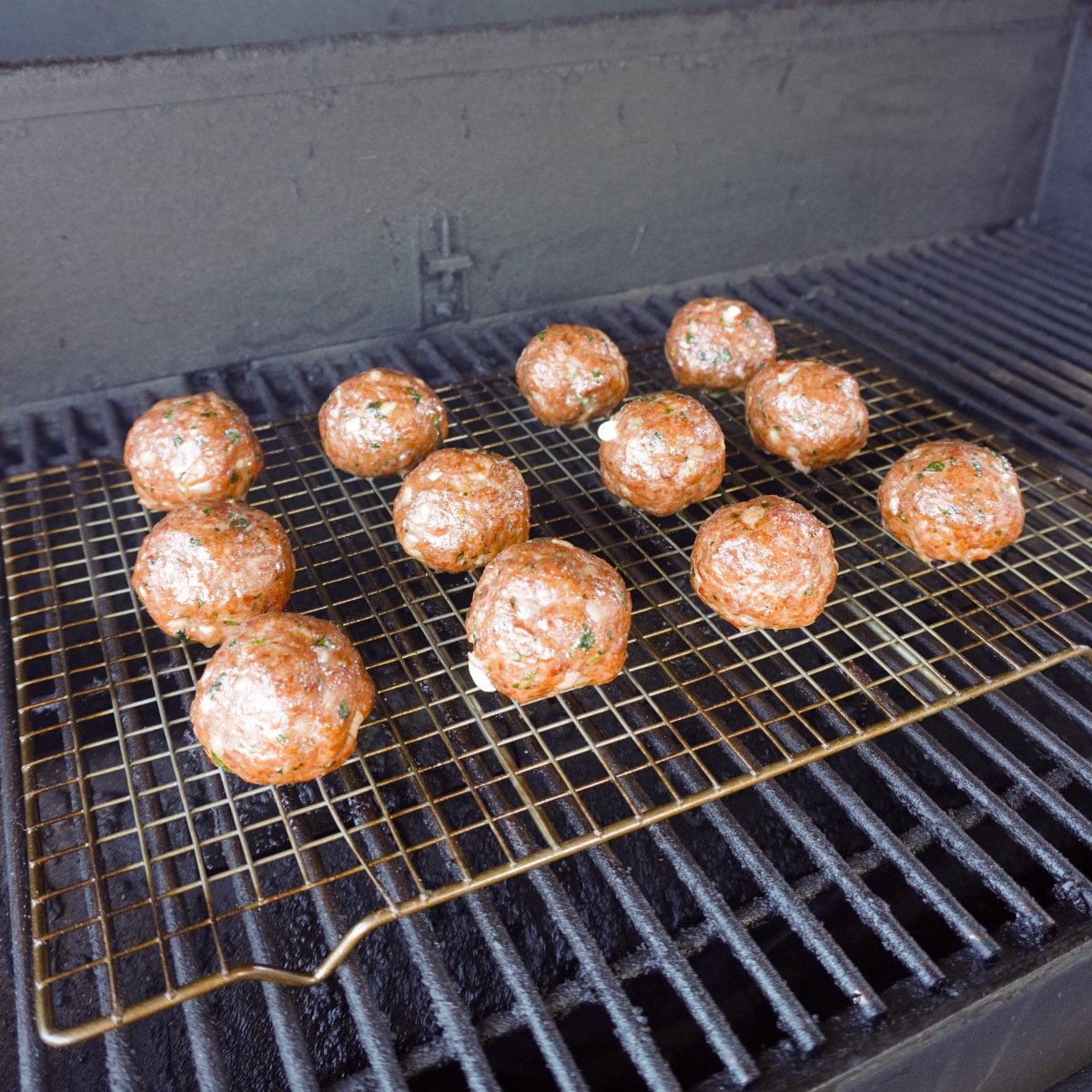 Smoked meatballs on the grill.