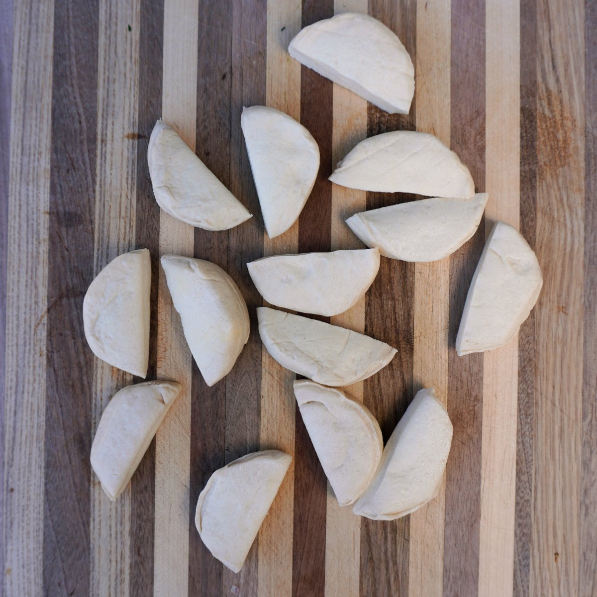 Sliced in half biscuit dough rounds.