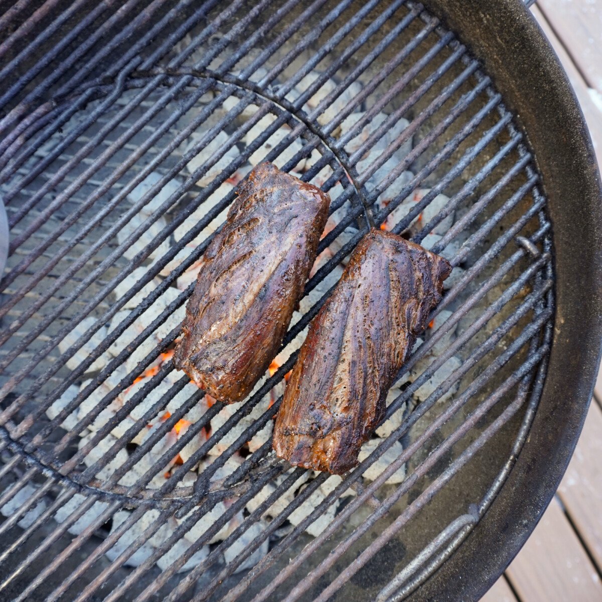 perfectly grilled venison tenderloin on the grill.