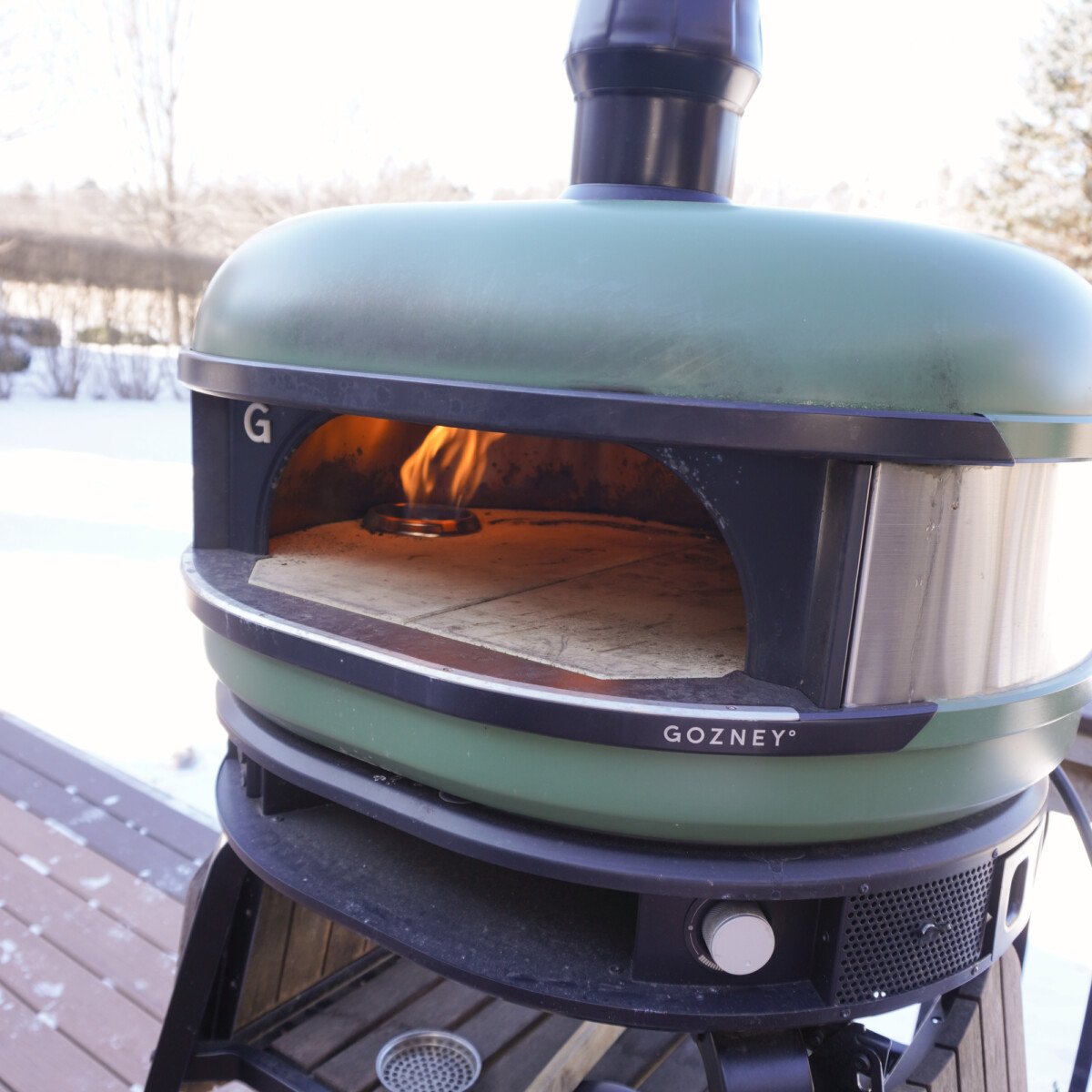 Gozney pizza grill lit up.