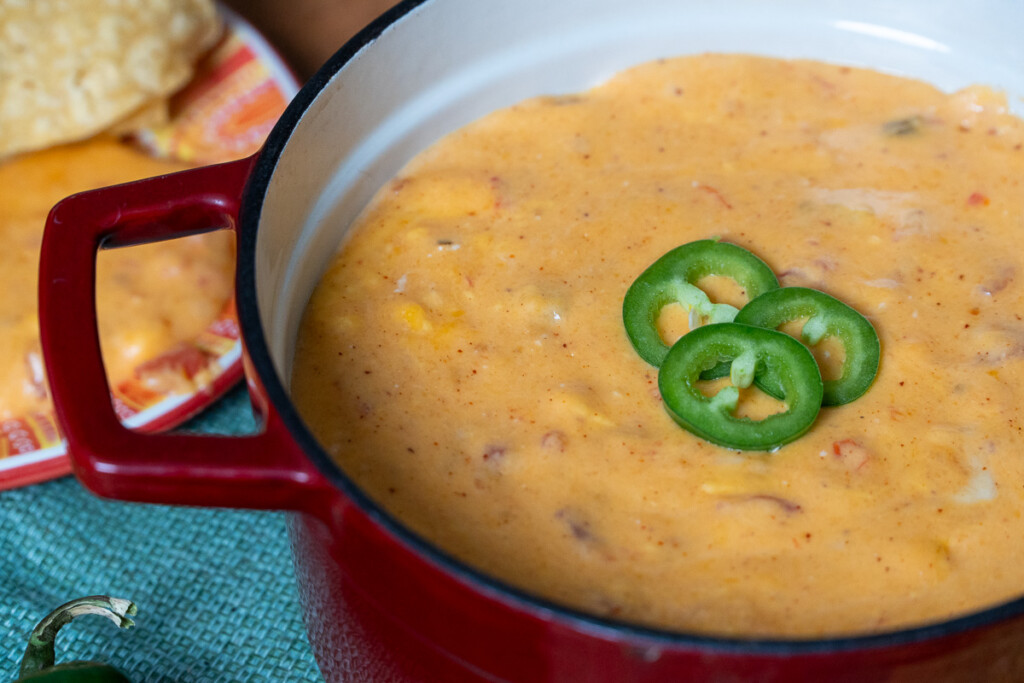 queso dip ready to serve in a red dish