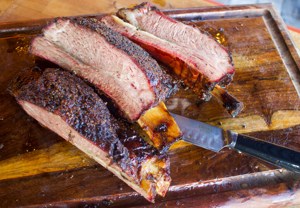 slices of cooked prime rib on a wooden board