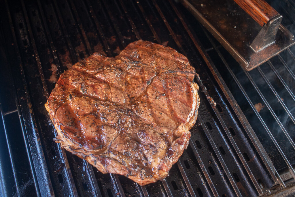 a cooked heart-shaped ribeye on the grill