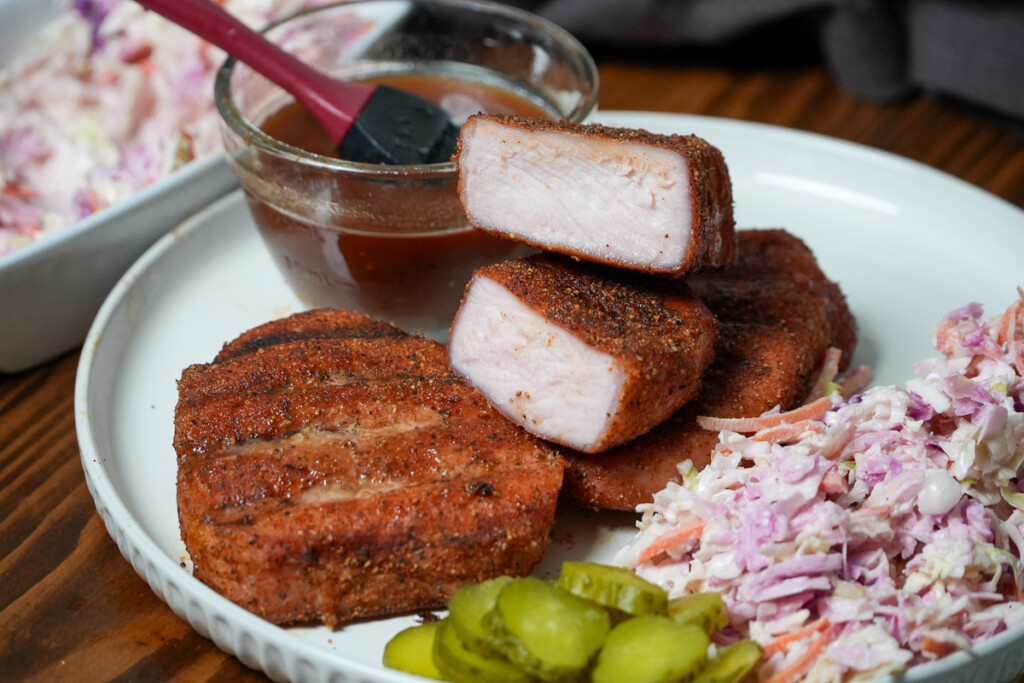 a cooked pork chop coated in seasoning