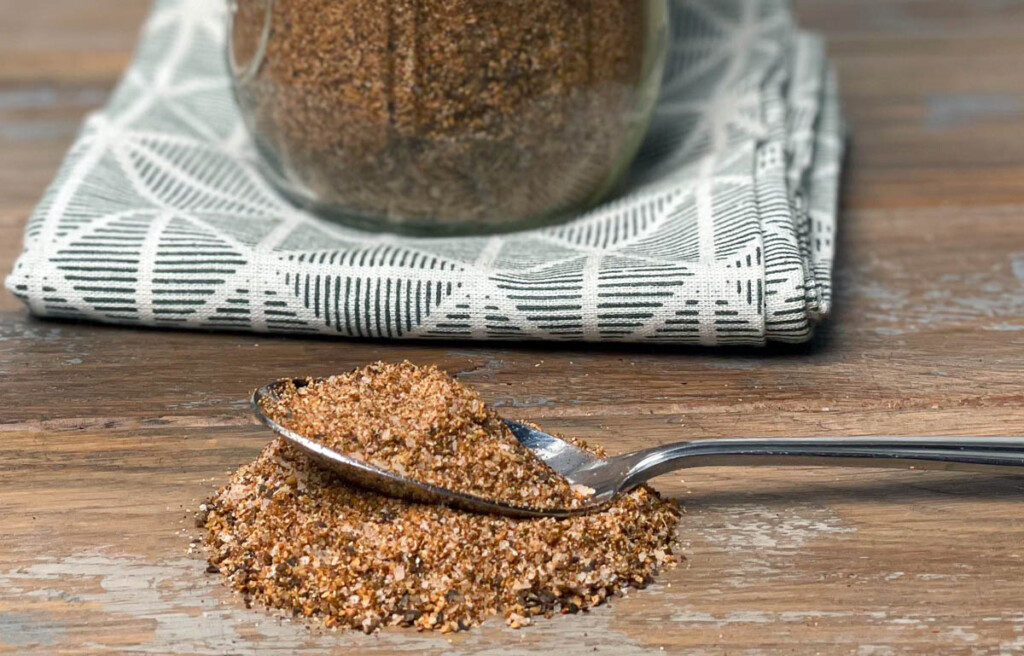 rib rub on a spoon with jar of rub behind it