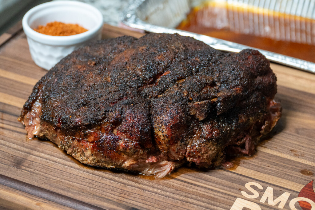 hot and fast pulled pork as a whole piece before shredding