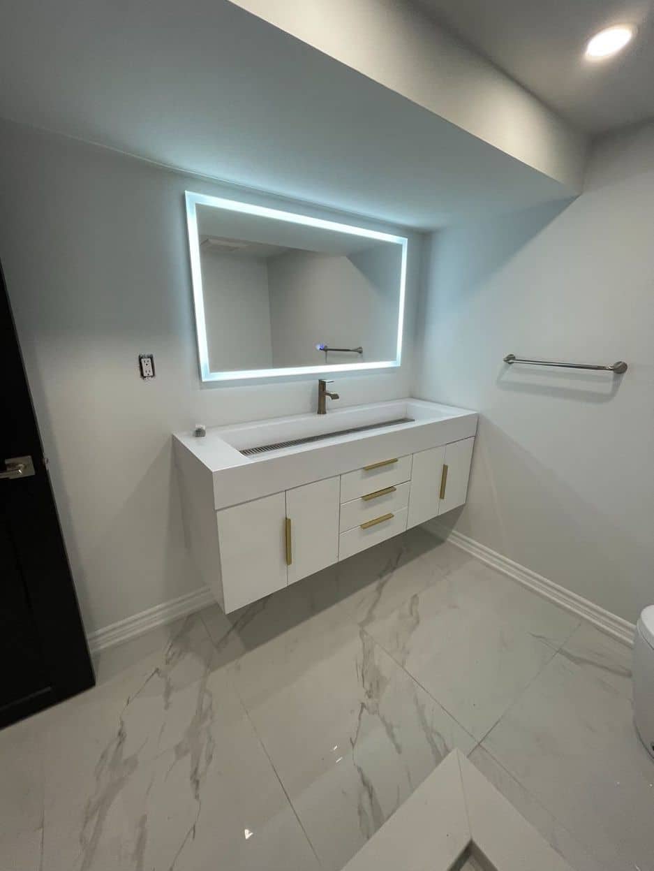 Etobicoke Renovation - Custom Free Floating Sink in Bathroom with lighted mirror