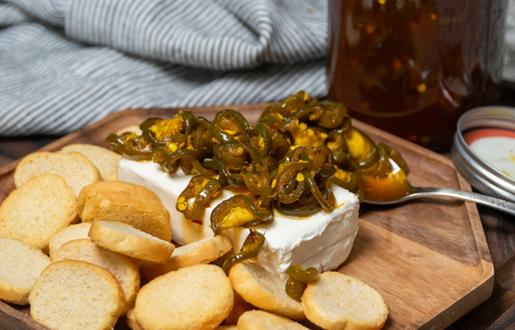 cowboy candy on cream cheese with crackers on the side