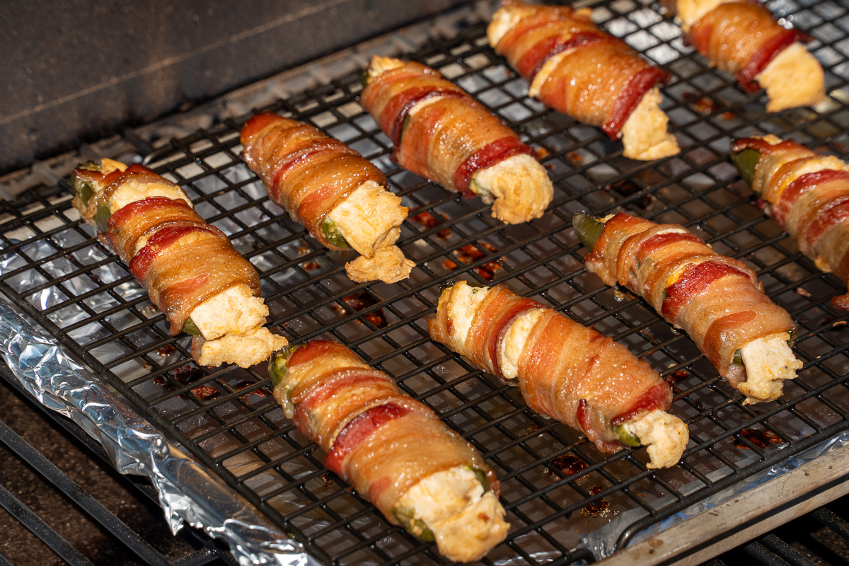 cooked jalapeno poppers in the smoker