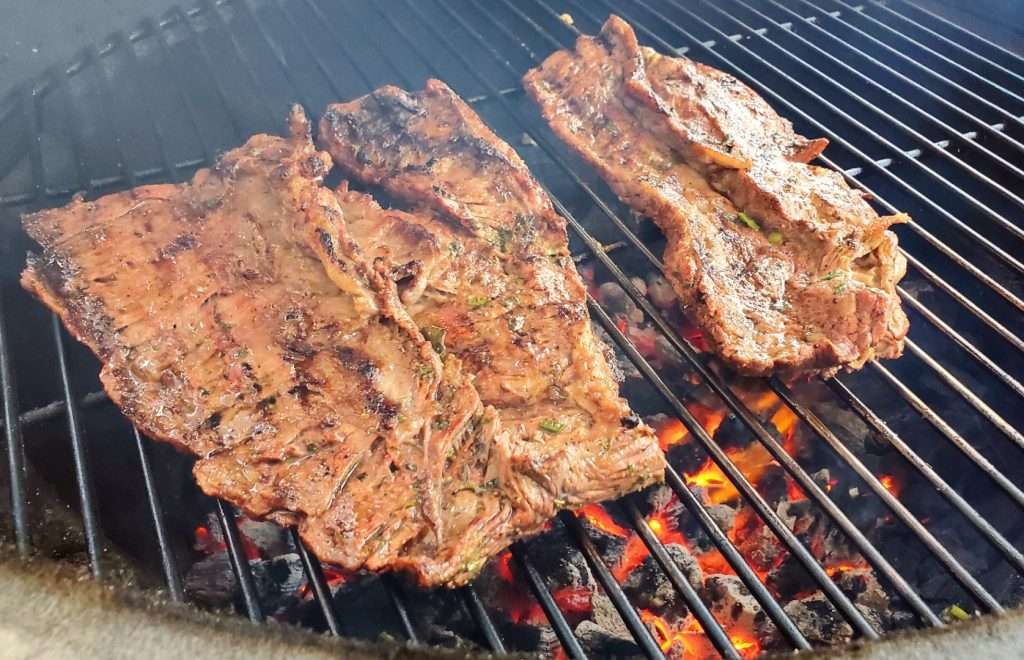 Marinated carne asada on grill