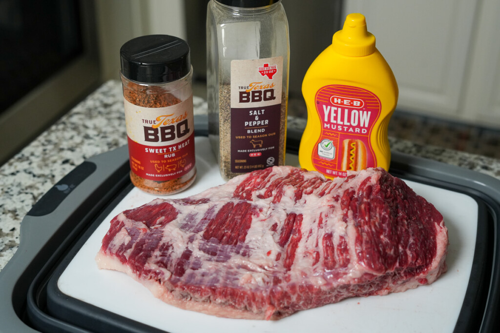 ingredients for smoked brisket point laid out on a white board