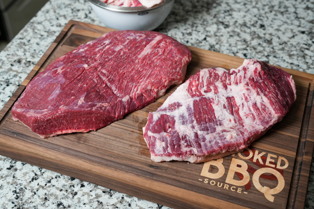 raw brisket flat and point on a wooden board