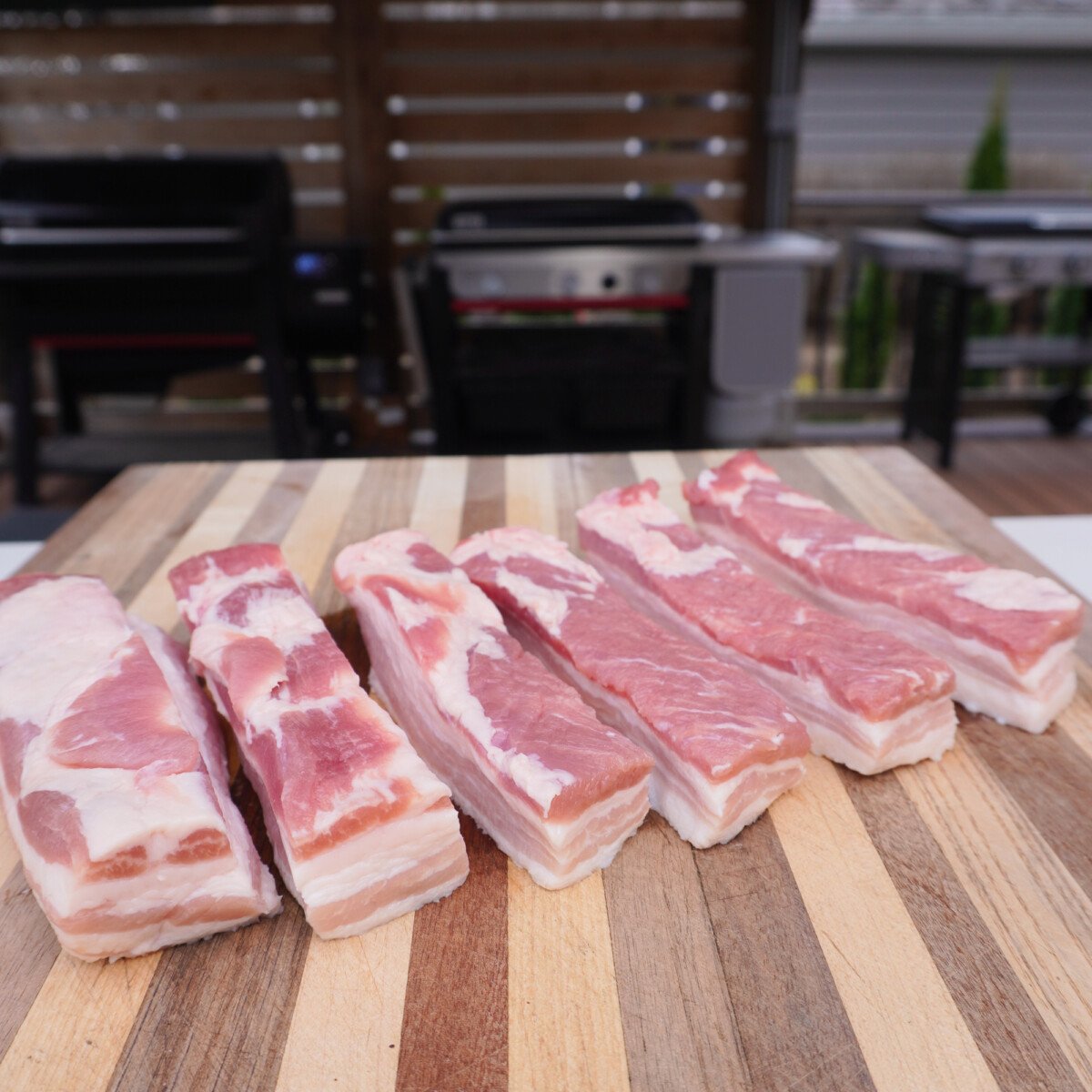 cut up raw pork belly.