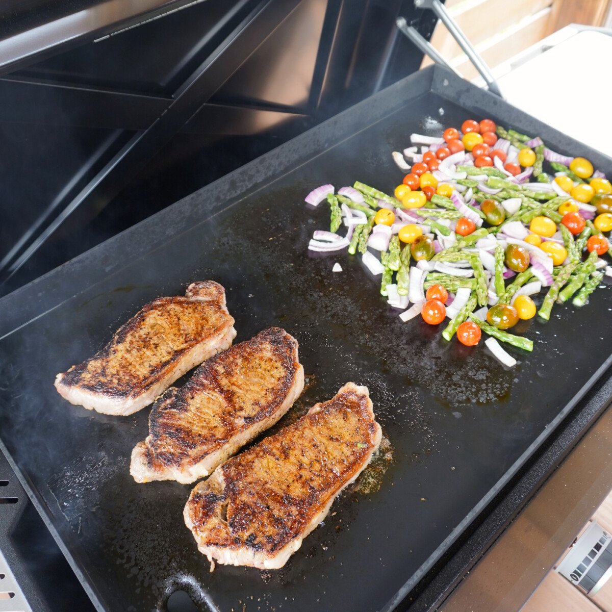 easy steak and veggies dinner grilled on a griddle.