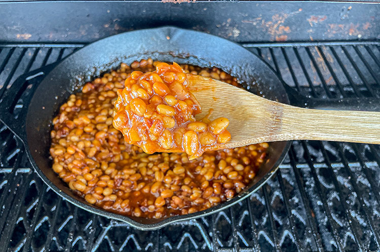 smoked baked beans on wood spoon