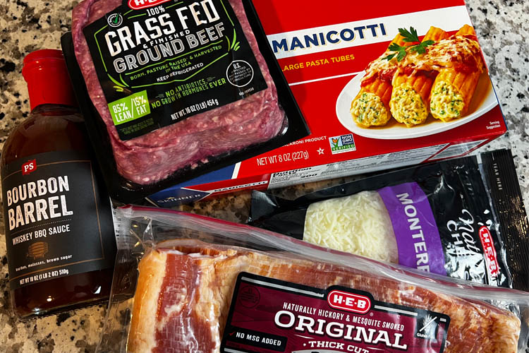 packets of minced beef, bacon, manacotti, parmesan and a bottle of bbq sauce