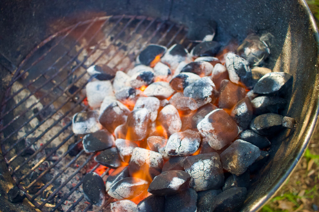 hot coals banked to the side of the grill