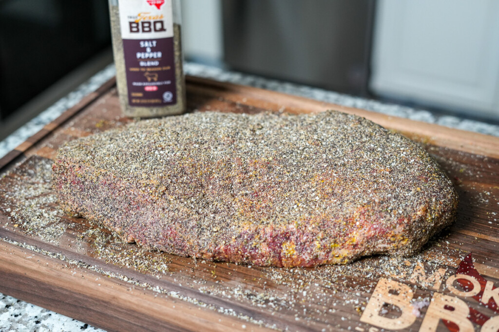a raw pice of brisket flat with seasoning