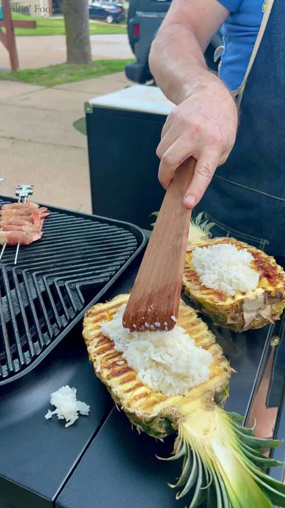 Filling Pineapple Boats with Rice