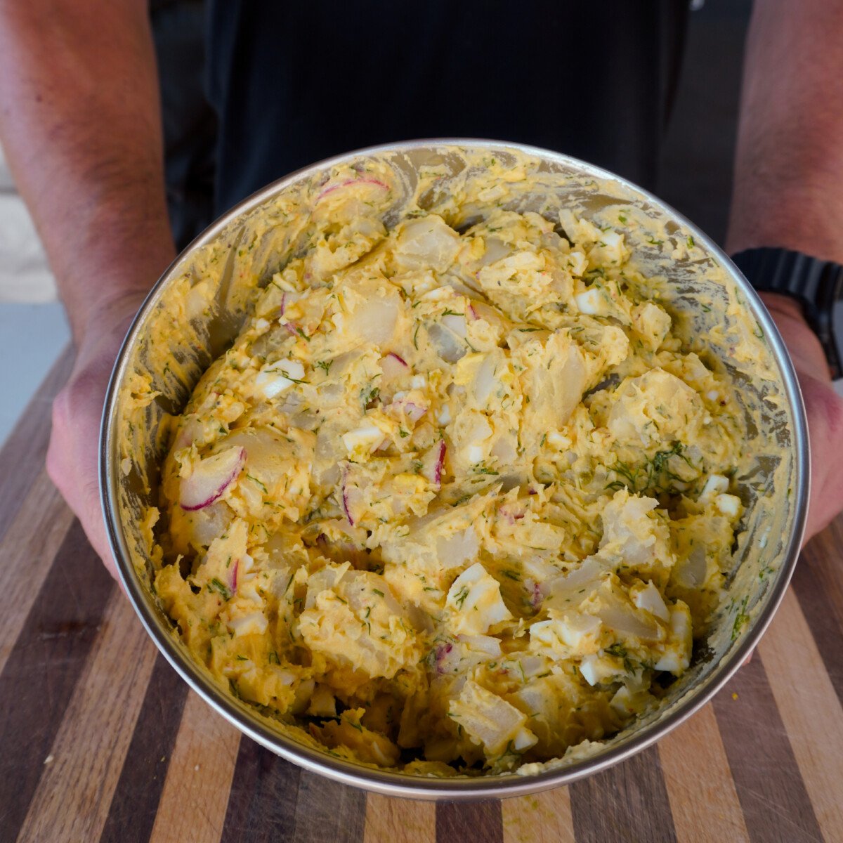 Mixed potato salad in a large bowl.