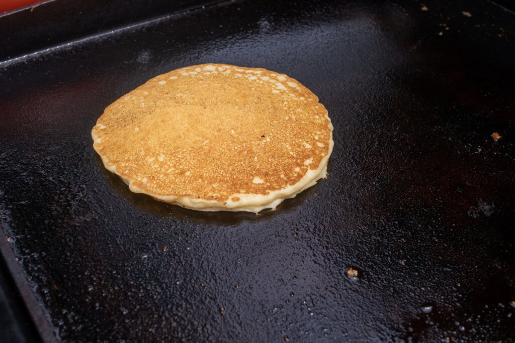 a cooked pancake on the griddle