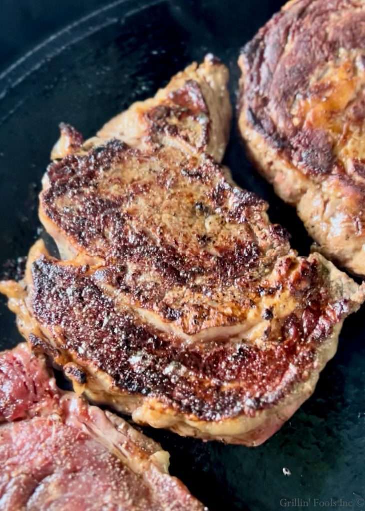 Cast Iron Ribeyes on the Grill