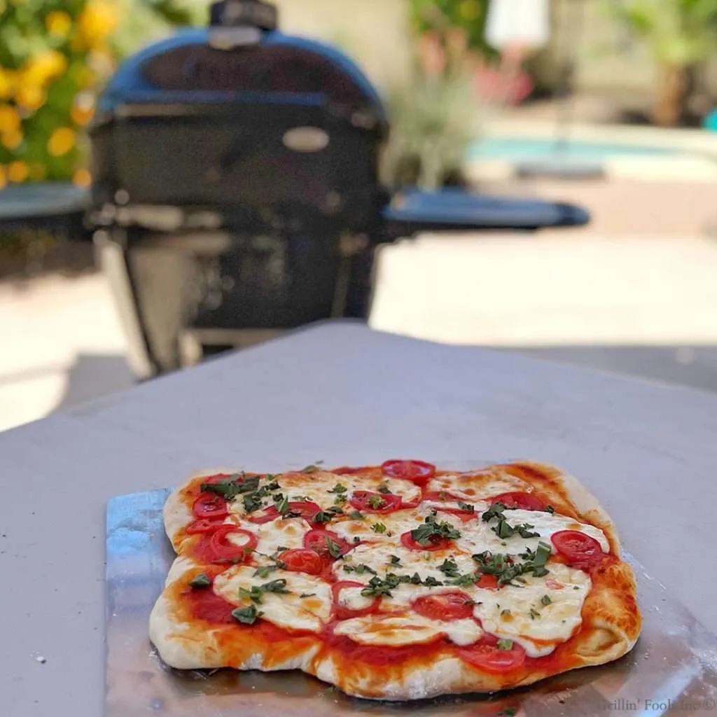 Grilled Pizza Margherita with the Fresh Basil added