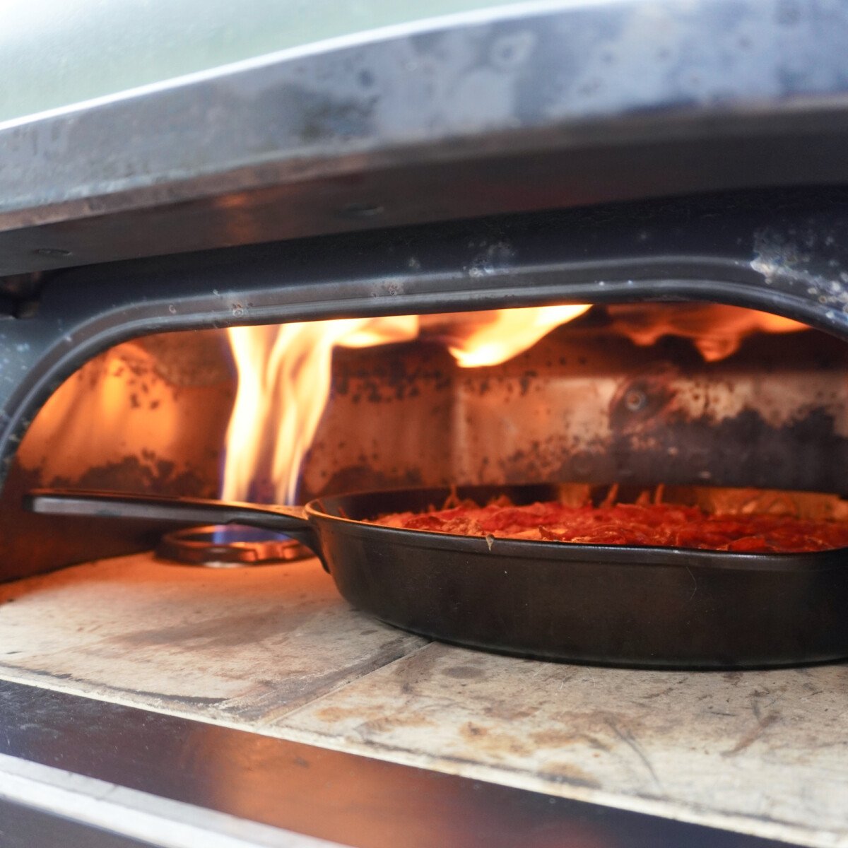 easy cast iron pizza in pizza oven.