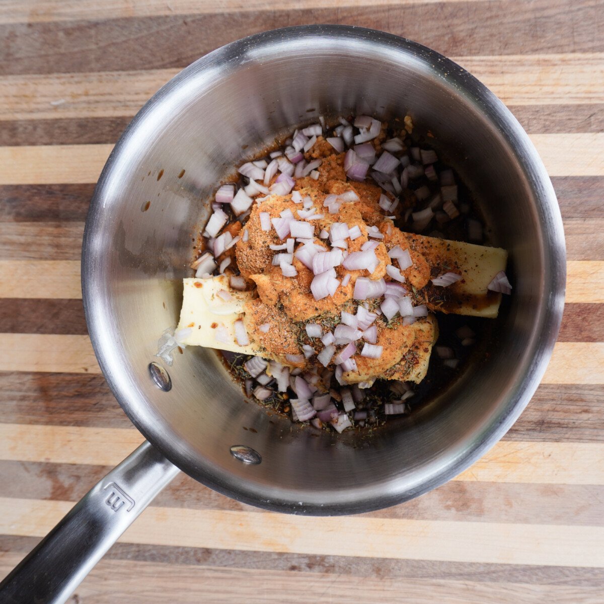 cowboy sauce ingredients in a sauce pan.