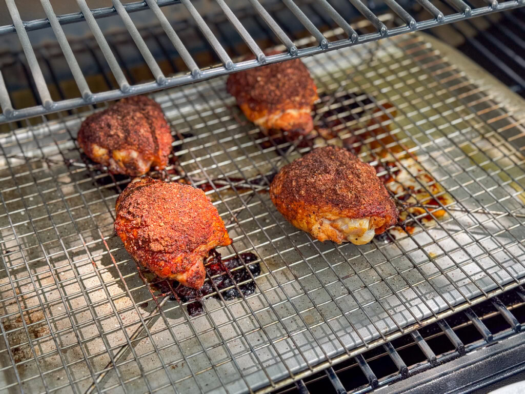 cooked chicken thighs in the smoker