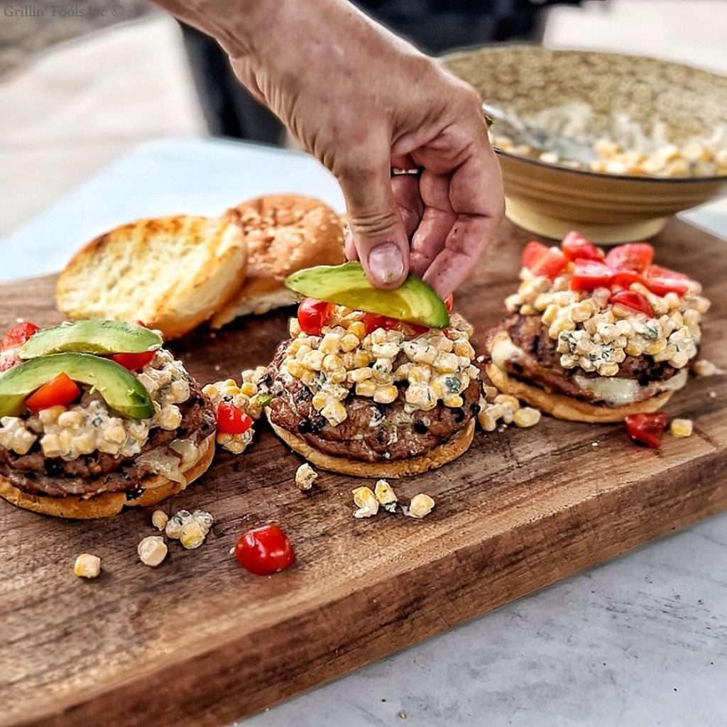 Grilled Turkey Burgers topped with Corn Relish and fresh Avocado