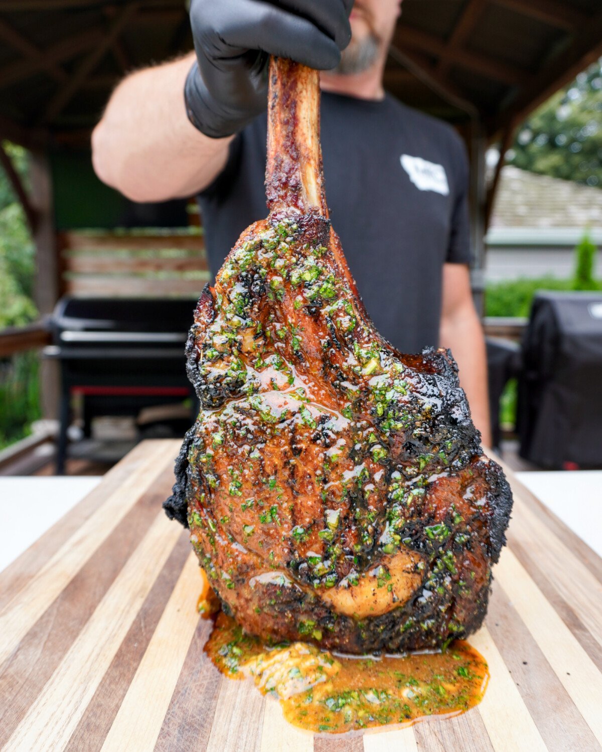 grilled tomahawk steak with cajun honey butter.