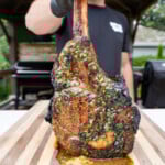 grilled tomahawk steak with cajun honey butter.