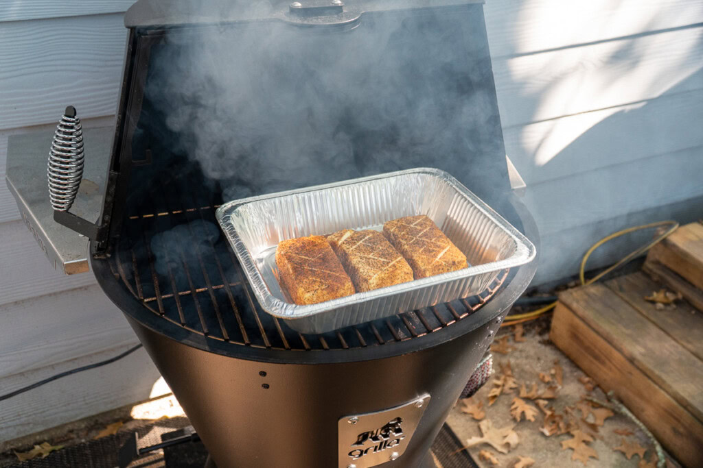 three blocks of cream cheese in the smoker