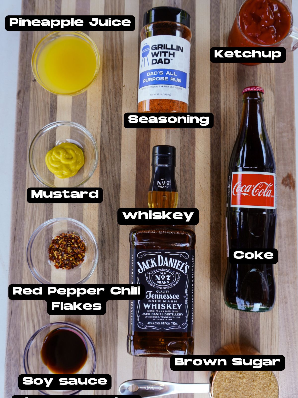 Ingredients needed to make a homemade Jack and Coke BBQ sauce.