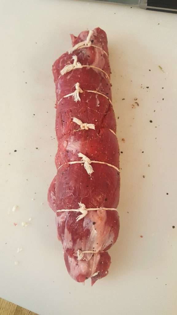 rolling-and-typing-flank-steak