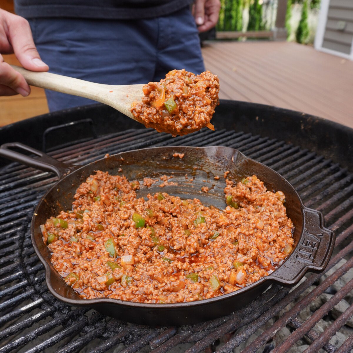 Sloppy joe mixture cooked in a cast iron skillet.