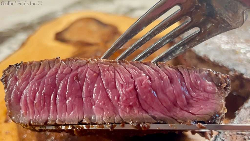 A slice of medium rare grilled sirloin steak A slice of medium rare grilled sirloin steak
