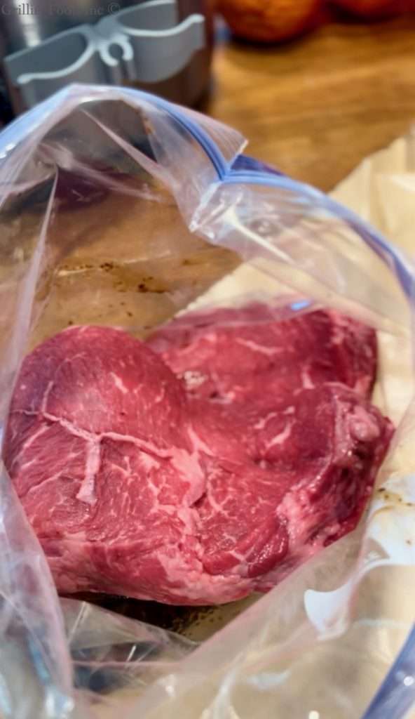 Sirloin Steak going into the bag to be brined