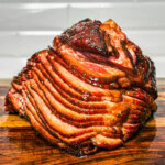 a twice smoked ham on a wooden board