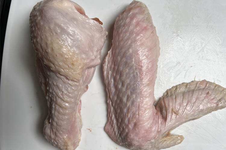 turkey wing cut into drum and wing on white board