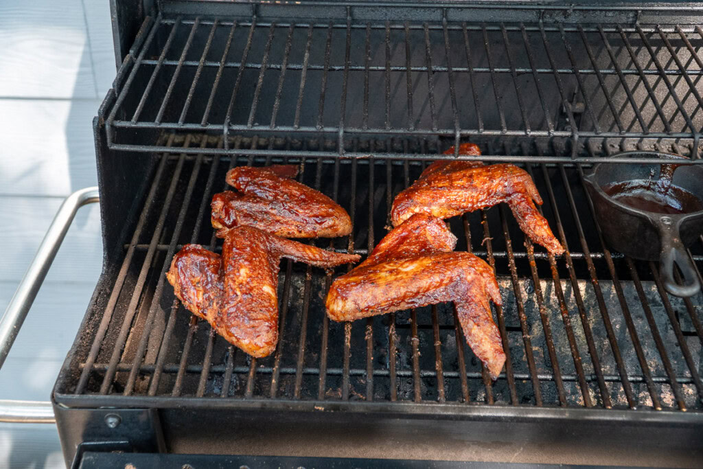 basted turkey wings in the smoker