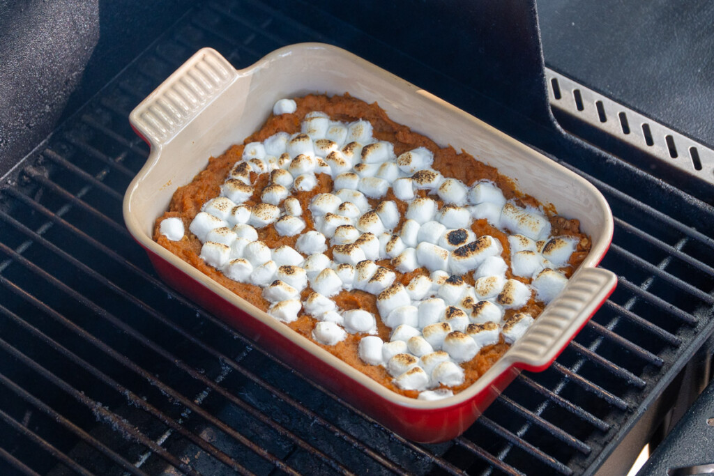 smoked sweet potato casserold with toasted marshmellows on top in the smoker