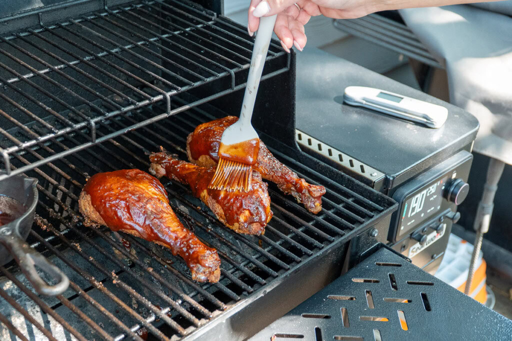 smoked turkey legs well coated in bbq sauce