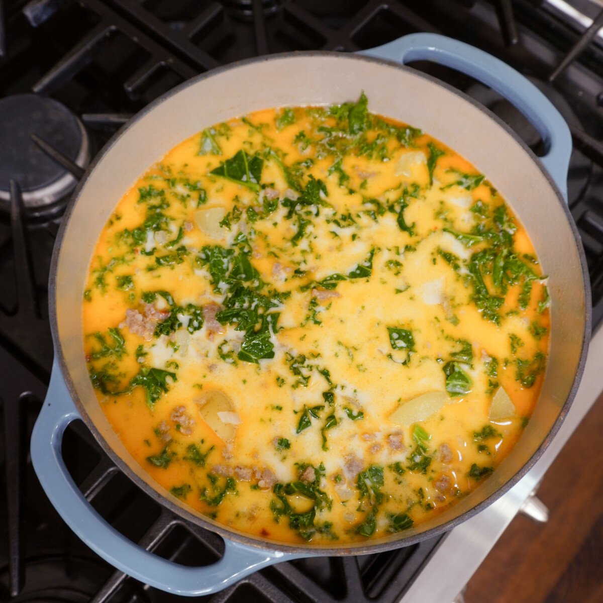 homemade zuppa toscana simmering on the stove top.