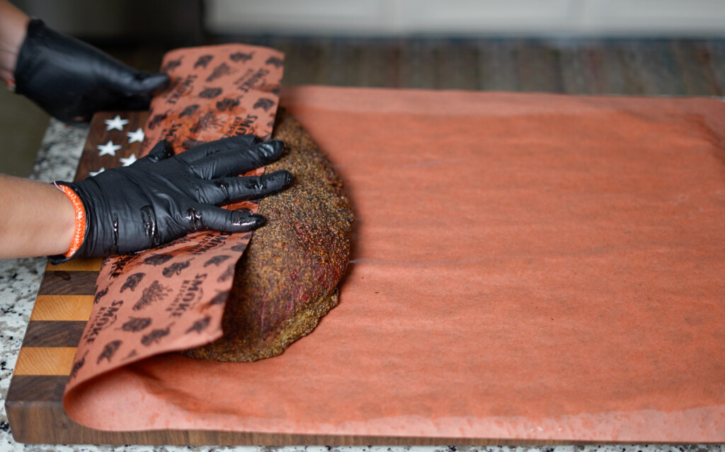step three of wrapping brisket in butcher paper